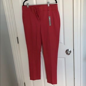 Light red women’s dress pants.